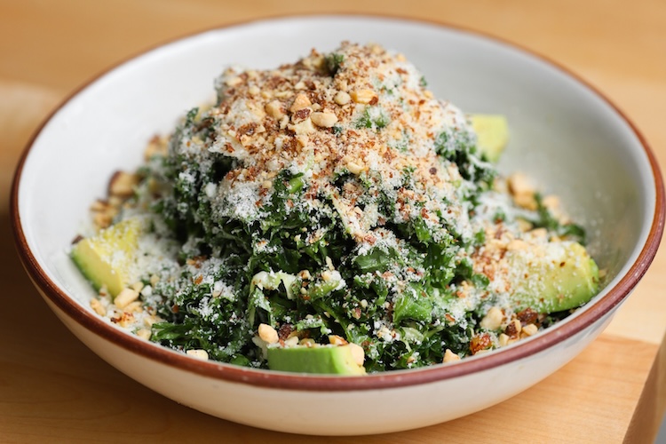 A bowl of kale salad.