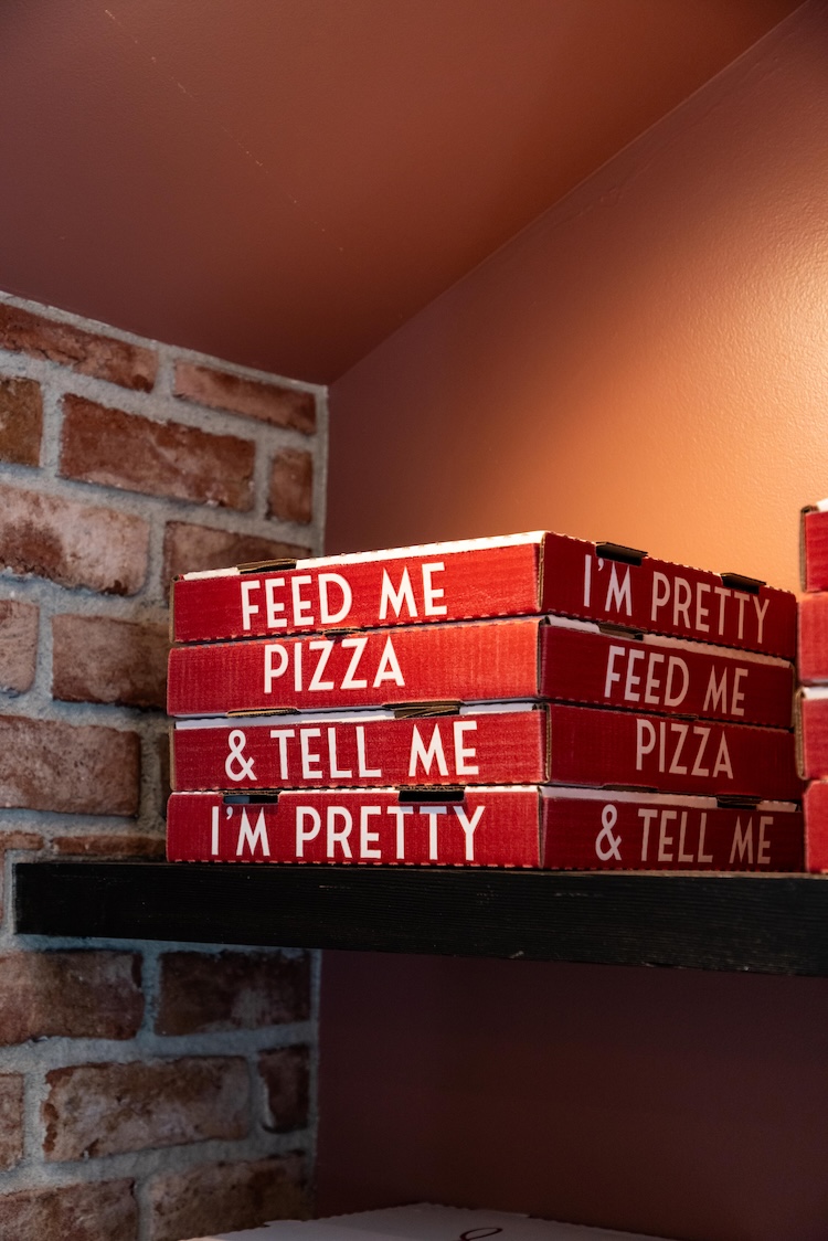 A stack of pizza boxes.