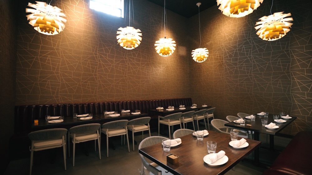 Our first semi-private indoor dining room is perfect for intimate gatherings and can accommodate up to 22 guests.
