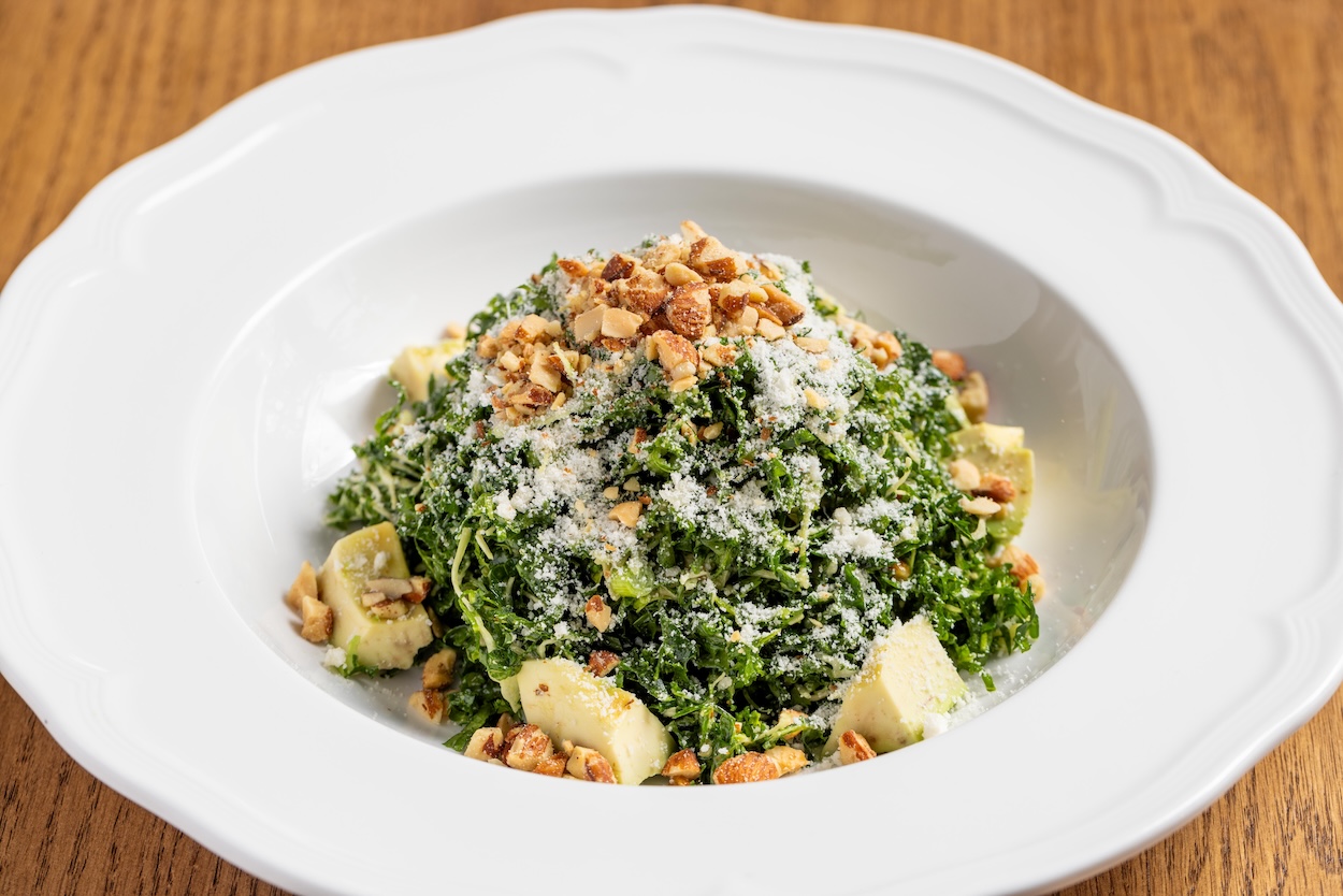 A bowl of kale salad.